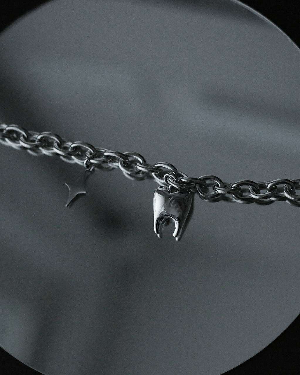 Monora Stainless Steel Whimsy: Tooth Meets Star Pendant Necklace