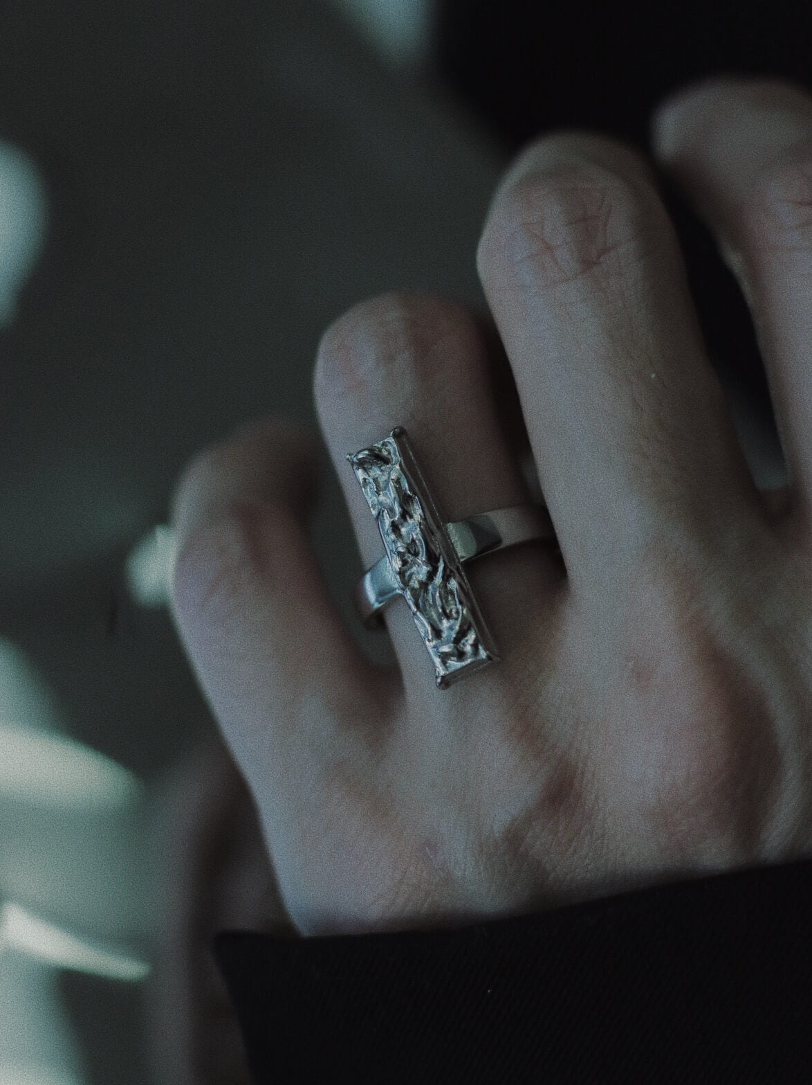 Close up of hand wearing Monora Studio modern punk molten metal slab ring unisex fashion⁠