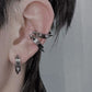 Unisex stainless steel spike hoop earrings styled as ear cuffs, waterproof industrial gothic jewelry by Monora Studio.
