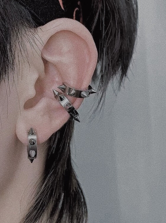 Unisex stainless steel spike hoop earrings styled as ear cuffs, waterproof industrial gothic jewelry by Monora Studio.
