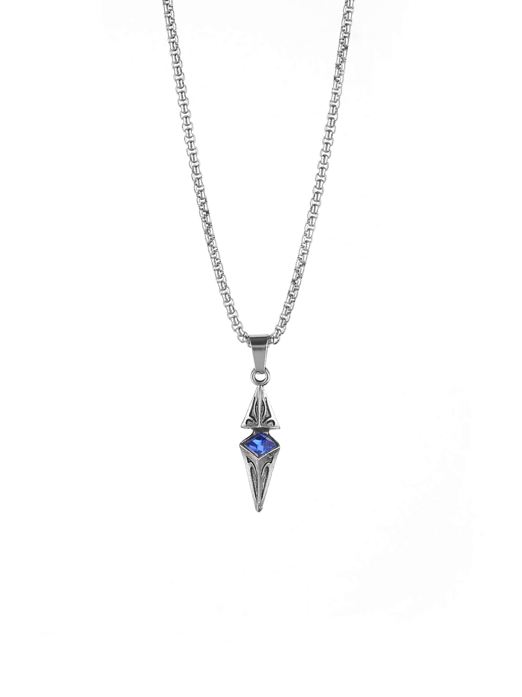 Professional product studio shot of Monora Studio silver geometric dagger pendant with blue rhinestone center on pure white background⁠