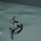 Side view of Monora Studio durable titanium steel architectural statement ring on a reflective mirror⁠
