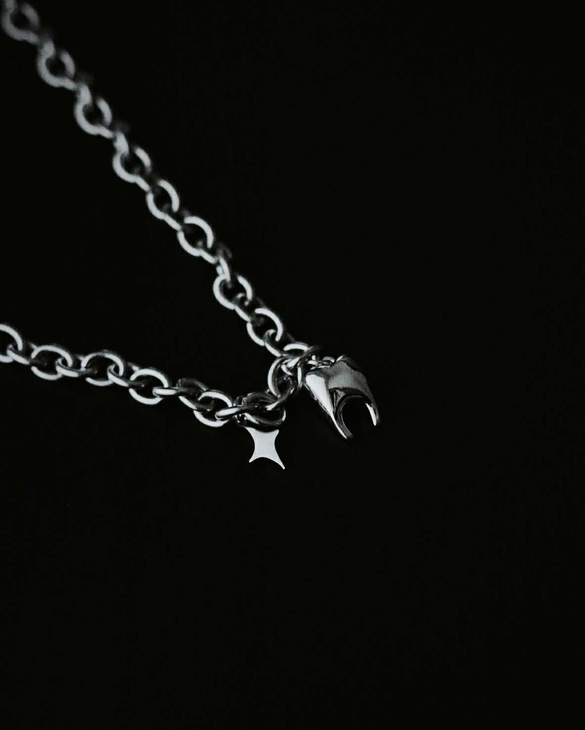 Monora Stainless Steel Whimsy: Tooth Meets Star Pendant Necklace