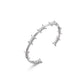 Professional product studio shot of Monora Studio geometric silver wire thorn bracelet on pure white background⁠