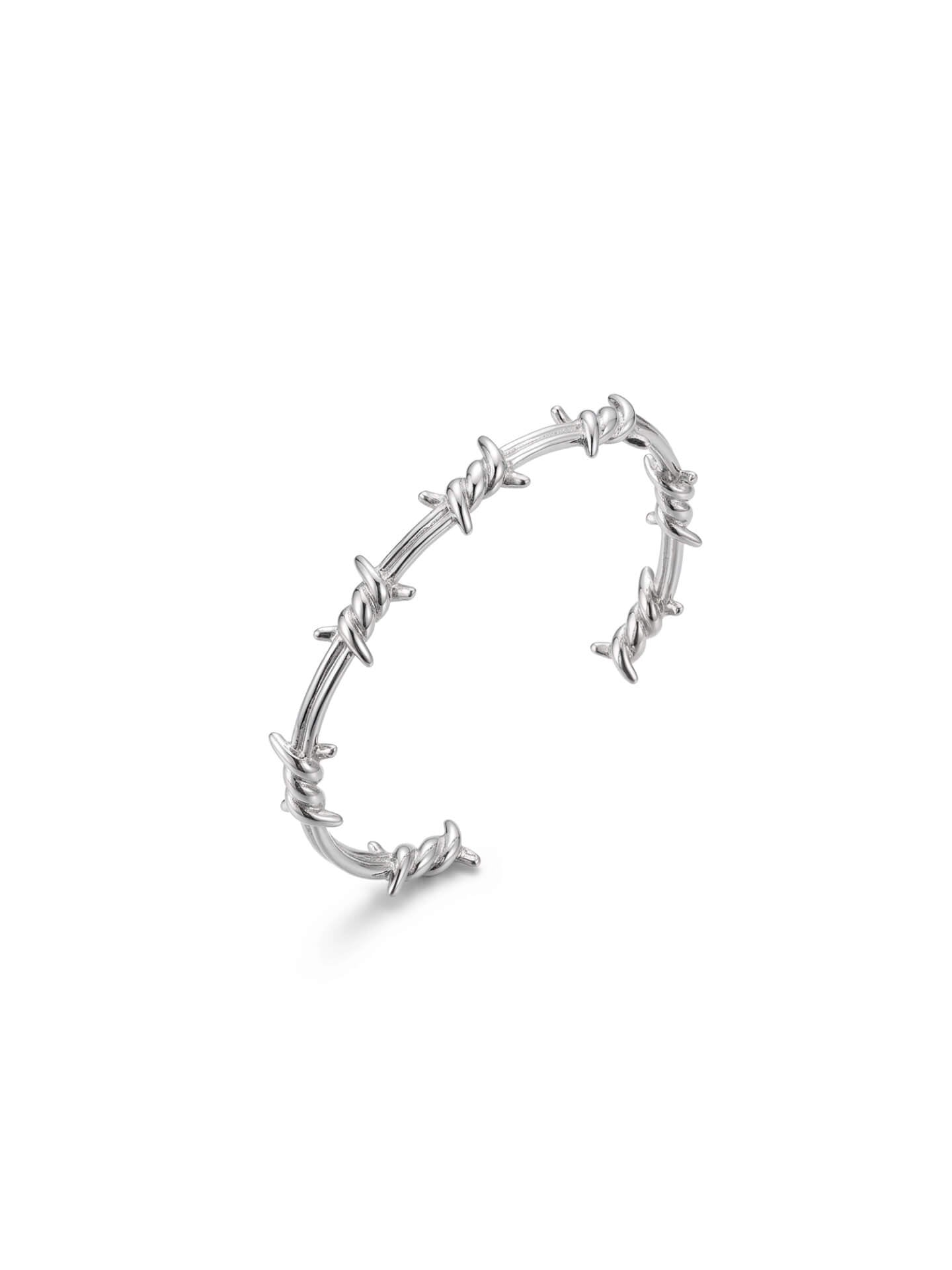 Professional product studio shot of Monora Studio geometric silver wire thorn bracelet on pure white background⁠