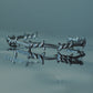 Monora Studio stainless steel barbed wire cuff bracelet reflecting on dark glass water surface close up⁠