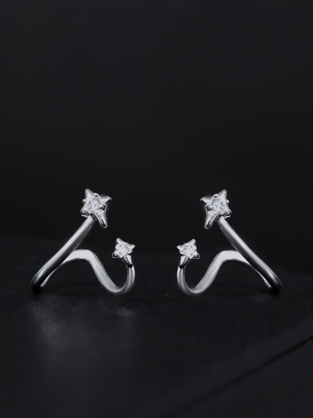 925 sterling silver star earrings with asymmetrical wave loop design, minimalist and edgy look.