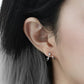 925 sterling silver star earrings with asymmetrical wave loop design, minimalist and edgy look.
