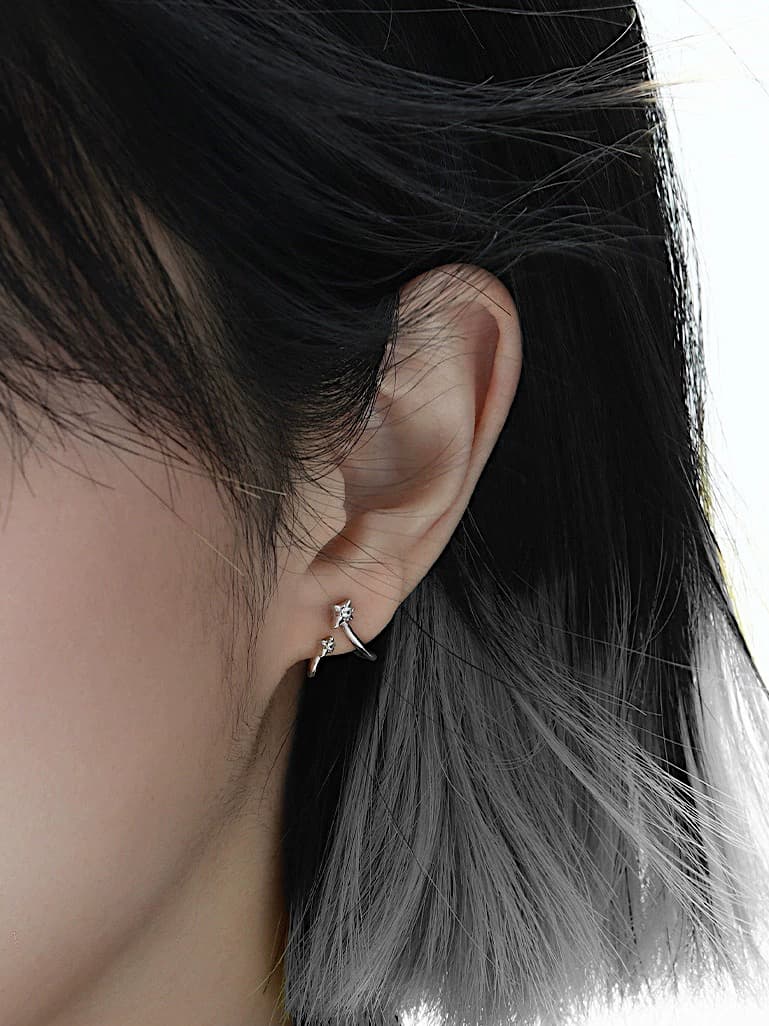 925 sterling silver star earrings with asymmetrical wave loop design, minimalist and edgy look.
