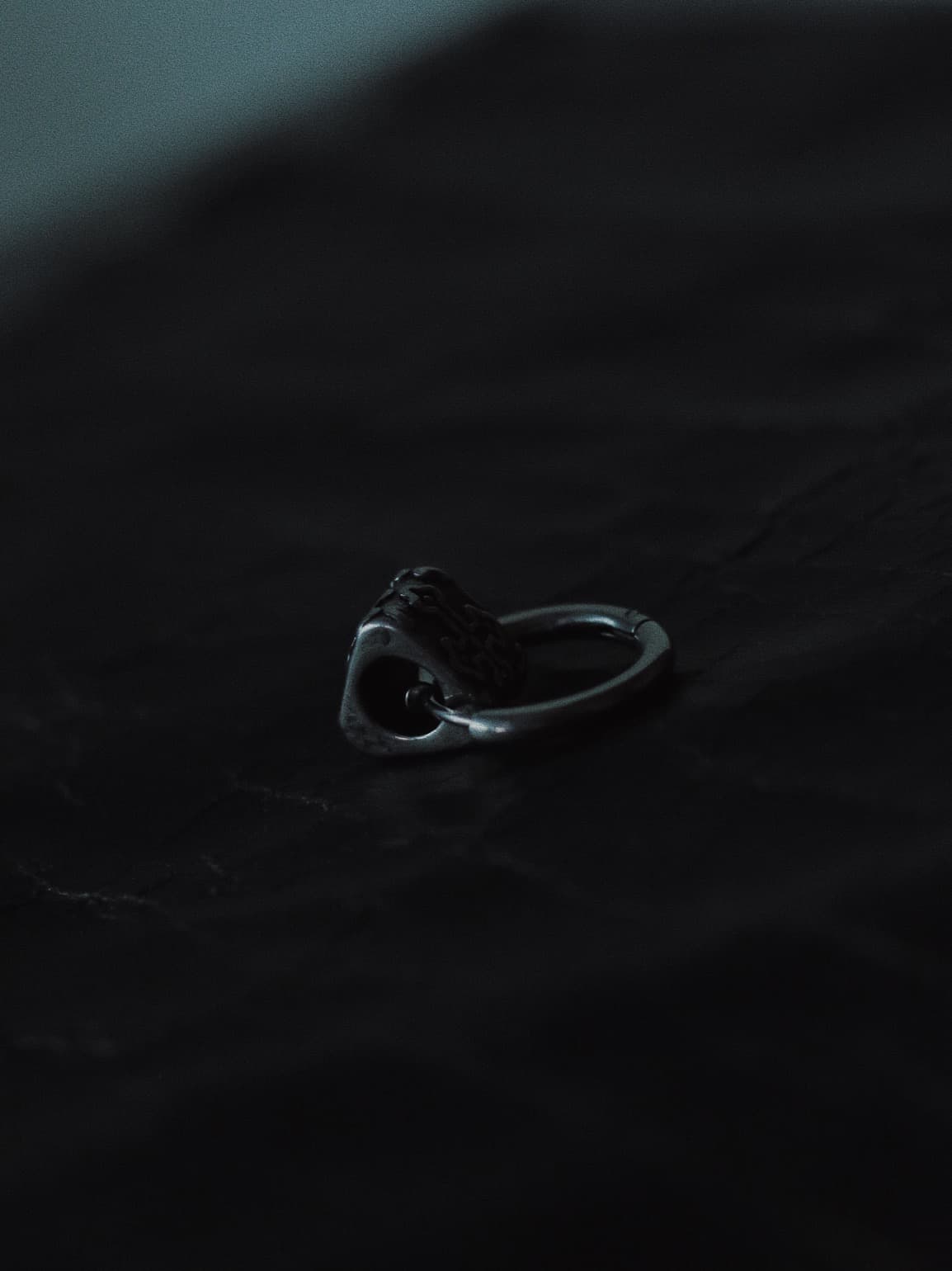 stainless steel crucifix lock hoop earring with gothic design – dark punk streetwear accessory.
