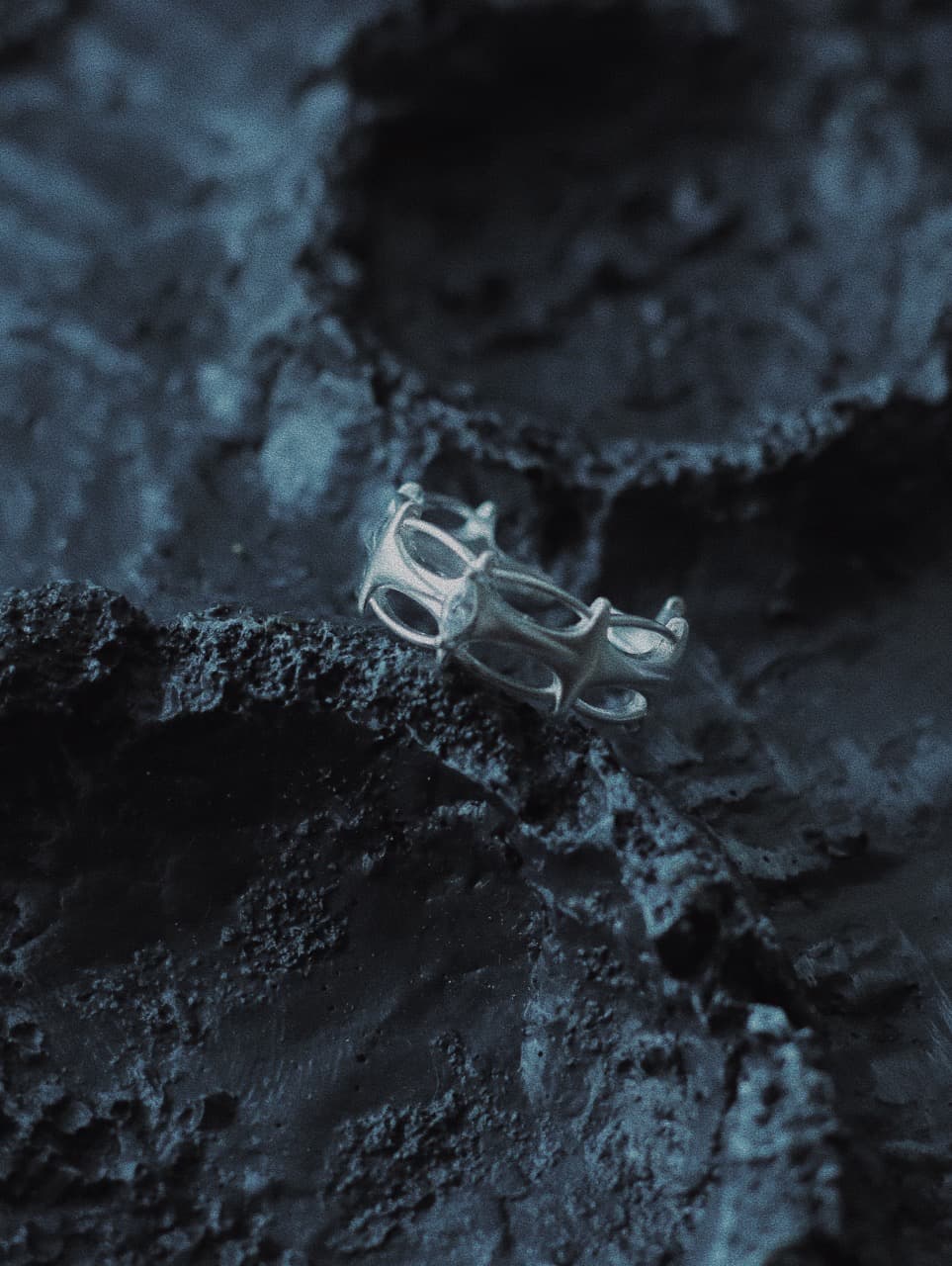 925 sterling silver openwork ring with architectural cutout design.